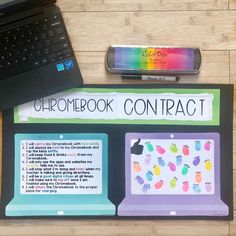 an open laptop computer sitting on top of a wooden table next to a notebook and pen