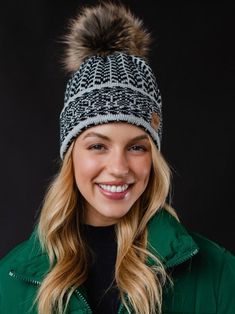 Get cozy and stylish with our Light Gray and Black Pattern Pom Beanie Hat. The knit design features a playful mix of gray and black patterns, topped off with a fluffy faux fur pom. Plus, stay warm and extra snug with the fleece lining. Perfect for those chilly days! Casual Winter Hat With Faux Fur Trim, Beanie With Faux Fur Trim For Cold Weather, Cold Weather Beanie With Faux Fur Trim, Casual Winter Hats With Pom Poms, Casual Pom Pom Hat For Cold Weather, Mobile Boutique, Blowout Sale, Pom Beanie, Gift Boutique