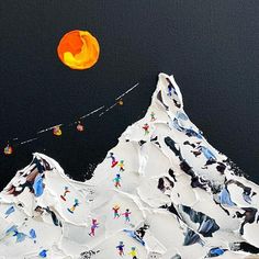 an orange ball is flying over the top of a snowy mountain with skiers on it