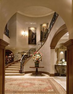 an elegant entry way leading up to the second floor