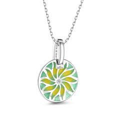 The motif of the compass flower radiating in gold loses itself in infinity, just like the sea does. A pretty necklace made from sterling silver and green&yellow enamel tones. The necklace is decorated with a delicate floral motif that radiates from its center. Elegant design.Carat Weight: 0.135 ctStone Size: 1,1.75 mmNumber of Stones: 10 Stone Shape: RoundStone Color: Diamond WhiteWeight: 3.1 gWidth: 15.9 mmHeight: 22.9 mmThickness: 4.9 mmMaterial: 925 SilverStone Type: Jeulia® StonePlating Colo Green Necklace With Flower Charm And Round Pendant, Green Necklace With Large Medallion Pendant, Green Necklace With Detachable Round Pendant, Green Pendant Necklace With Flower Charm, Green Flower Charm Jewelry With Round Pendant, Green Flower Charm Round Pendant Jewelry, Green Enamel Charm Jewelry, Green Enamel Jewelry With Charms, Green Round Charms Jewelry