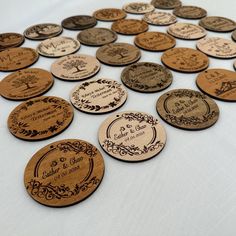 many different types of wooden coasters on a table