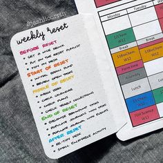 an open planner with the words weekly report written in bright colors on top of it