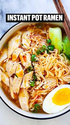 a bowl of ramen with an egg on top and chopsticks next to it