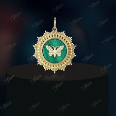 "Wearing this 22mm butterfly pendant with a 0.055carat diamond with 1.487carat malachite might just give you the feeling of owning a piece of heaven. Set in 3.083gms of 14K yellow gold, the butterfly pendant weighs 3.391gms. Please contact us for bulk discount up to 40%. All weight and dimensions are approximate and varies once item is ready for shipping. Feel free to contact us for any customization as all jewelry is made to order and we'll gladly accommodate. Click on 🤍 to save it in your \"F Gold Plated Butterfly Pendant Necklace, Yellow Gold Pendant Jewelry With Butterfly Clasp, Gold Round Pendant With Butterfly Charm, Green Butterfly Charm Pendant Necklace, Green Butterfly Pendant Necklace, Yellow Gold Round Jewelry With Butterfly Charm, Butterfly Charm Pendant For Jewelry Making, Malachite Butterfly, Round Diamond Pendant