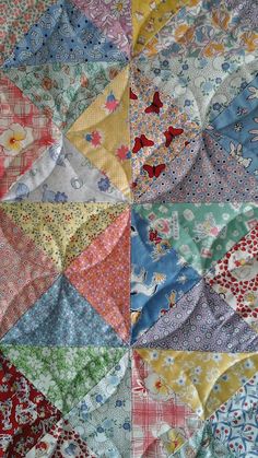 an old quilt with many different colors and patterns