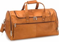 "The 22-Inch Voyager Duffel is the obvious choice for the ideal light travel bag, with its premium material, expert craftsmanship and thoughtful design. Artisan-crafted from full-grain South American Vaquetta leather, this duffel bag adds pleasure to any trip. The spacious, fully-lined main compartment is accessed via a convenient double zipper and includes an interior zip pocket for organizing your belongings. The exterior features two roomy side compartments and two additional large zipper pockets at the front and back. Carry the Voyager Duffel easily over your shoulder, or remove the adjustable strap and grab it by its two sturdy, riveted handles. No worries about damaging the bottom, either, with its protective metal feet. Choose among three rich tones of supple leather, accented with Luxury Soft Leather Everyday Duffle Bag, Luxury Leather Duffle Bag For Overnight Trips, Luxury Leather Lined Duffle Bag For Daily Use, Luxury Soft Leather Duffle Bag For Business Trips, Luxury Leather Duffle Bag With Double Handle, Luxury Leather Duffle Bag For Errands, Luxury Leather Travel Bag With Main Compartment, Luxury Leather-lined Duffle Bag With Double Handle, Luxury Soft Leather Functional Duffle Bag