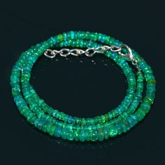 "Natural Ethiopian Green Fire Opal Smooth Rondelle Beads Necklace Gemstone Type : Natural Item Code : 7019 Origin-:100% Natural Green Fire Opal Necklace Grade-: AAA++ Stone shape-: Smooth Rondelle Beads Stone color-: Same As Picture Metal-: Length-: 16 Inch Quantity-: 1 Strand Necklace Approx Weight : 36.70 Carat Approx Size : 3-5 MM 100% Genuine & Natural ABOUT US skgemsstone based in Jaipur, India is a company engaged in supplier, manufacturing, wholesale and retail business of Gemstones ( Opal Beaded Necklace, Fire Opal Green Necklace, Fire Opal Necklace, Green Fire, Necklace Green, Moonstone Beads, Green Opal, Necklace Gemstone, Jaipur India