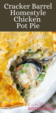 a close up of a chicken pot pie on a plate with a spoon in it