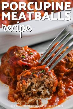 meatballs with marinara sauce and rice on a white plate next to a fork