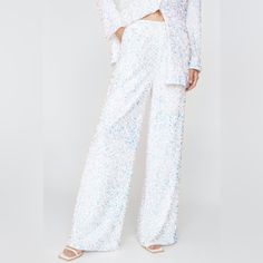 Size Us 2 Style: Tailored Trousers Fabric: Woven Length: Stacked Fabric: 100% Polyester. Full Sequin Style. Hand Wash Only Sequin Wide Leg Pants, Wide Leg Pants White, Sparkly Pants, Black Flares, Striped Flare Pants, Cheetah Print Leggings, Iridescent Sequin, Wide Leg Lounge Pants, Printed Flare Pants