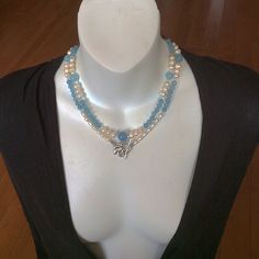 This combo style spiritual necklace handmade with round Aquamarine and Pearl beads. It will be a nice gift for sophisticated fashion and/or jewelry lover.  Our pictures show how we could wear this Blue and Pearl beautiful combo necklace.  By its metaphysical meaning, Aquamarine increases leadership abilities. Pearl is known as a nature wisdom creature. Each Pearl is unique, it absorbs and holds different inspirational thoughts, and the energy of one bead doesn't blend with the energy of another. All kinds of the natural Pearls balance and heal all chakras. Elegant Multi-strand Crystal Necklace For Gift, Multi-strand Pearl Necklace With Natural Stones For Gifts, Gift Multi-strand Pearl Necklace With Natural Stones, Double Strand Beaded Jewelry For Gifts, Double Strand Gemstone Beads Jewelry Gift, Spiritual Double Strand Gemstone Beads Necklace, Bohemian Double Strand Pearl Necklace Gift, Spiritual Double Strand Gemstone Beaded Necklaces, Spiritual Pearl Necklace With Gemstone Beads As Gift