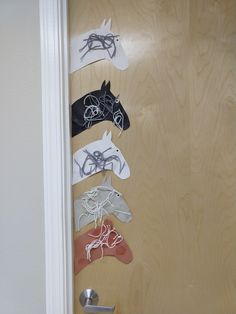 the door is decorated with paper horses on it