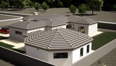 an aerial view of a house with two cars parked in the driveway