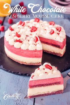 white chocolate raspberry mousse cake on a plate with one slice cut out