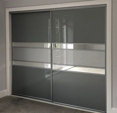 an empty room with sliding glass doors in it