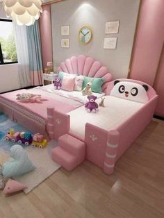 a bedroom with pink furniture and lots of stuffed animals on the floor in front of it