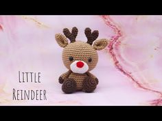 a small crocheted reindeer sitting on top of a pink and white background with the words how to sew and astaging little reindeer