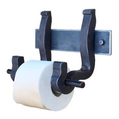 a roll of toilet paper hanging from a metal hook on a white wall with two black handles