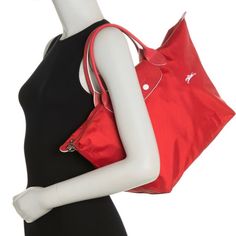 A Sturdy Nylon Top-Handle Bag Features A Leather Trim For Extra Durability And Added Style Points To Your Everyday Ensemble. 10.5"H X 18"W X 8"D 5" Handle Drop Nylon With Leather Trim Casual Red Nylon Shoulder Bag, Red Rectangular Nylon Shoulder Bag, Red Large Capacity Shoulder Bag For On-the-go, Large Capacity Red Nylon Bag, Red Nylon Back-to-school Bags, Longchamp Le Pliage Club, Red Nylon Shopping Bag, Longchamp Red, Longchamp Bags