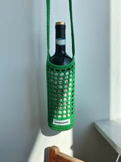 a bottle hanging from the side of a wall