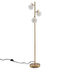 a floor lamp with three white balls on the base and one black cord attached to it