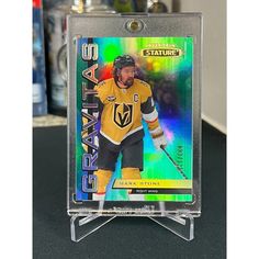 the hockey card is on display in a clear plastic holder with an acrylic background