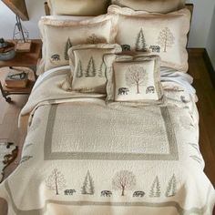 the comforter is made up and has trees on it