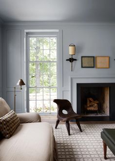 a living room with blue walls and furniture