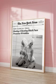 the new york news cover featuring two women in bathing suits on a wood floor with pink walls