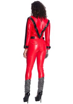 a woman in red leather suit and high heels standing back to back with her hands on her hips