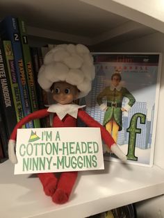 the elf is holding a sign that says i'm a cotton - headed minny - muggins