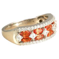 Gold(14K) : 3.88g Diamonds : (VS clarity & H-I colour) : (Brilliant cut ) : 0.35ct Gemstone : Orange Sapphire : 0.98ct A band of sunshine for your hand, the Phoebe ring is an elegant juxtaposition of the vivid hue of the orange sapphire with the white of evenly interspersed brilliant-cut diamonds. Enclosed in rings of pavé-set diamonds, this gorgeous ring is bound to add a little extra ‘sunny’ to your day! Orange Sapphire Ring, Orange Sapphire, Brilliant Cut Diamond, Sapphire Ring, Band Rings, Gold Diamond, Jewelry Rings, Sapphire, Band