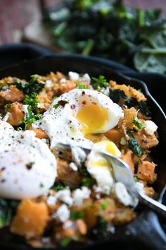 a skillet filled with eggs and vegetables