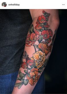 a person with a flower tattoo on their arm