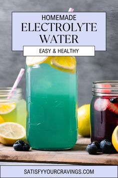 homemade electrolyte water in mason jars with lemons and blueberries