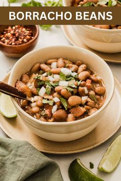 a white bowl filled with beans and garnished with cilantro