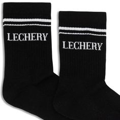 LECHERY® - Elevate your style with socks & knee-highs made for you. Add a touch of sporty sophistication to your outfit with these Unisex Varsity Striped Half-Crew Socks from LECHERY®. With their classic varsity stripe design, these socks exude a cool and retro vibe. Made with high-quality materials, they offer a comfortable and snug fit for all-day wear. Whether you're heading to the gym or styling them with your favorite sneakers, these socks are the perfect accessory to showcase your unique s Casual Black Knee-high Socks For Streetwear, Trendy Black Socks With Letter Print, Trendy Black Sports Socks, Casual Black Breathable Knee-high Socks, Black Sports Socks With Letter Print, Casual Black Knee-high Sports Socks, Black Sporty Socks With Letter Print, Sporty Letter Print Socks For Streetwear, Knee Highs