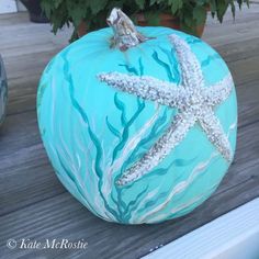 a painted pumpkin with a starfish on it