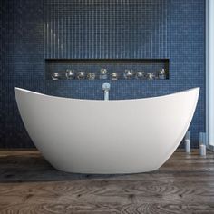 a large white bath tub sitting on top of a wooden floor