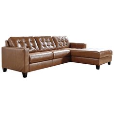 a brown leather sectional sofa sitting on top of a white floor