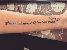 a person with a tattoo on their arm that says, i was his angel, you're mine