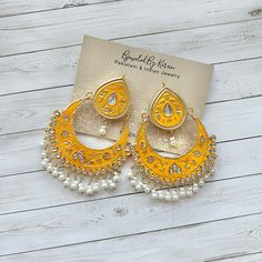 Mustard Yellow Chaandbali Jhumkas. Kundan handpainted Indian jhumka earrings.  Approx 3 inches in length Arrives in a gift box! White Jhumkas For Navratri Gift, Handmade Danglers For Navratri Gift, Hand Painted Festive Earrings For Festivals, Handmade Bollywood Danglers For Navratri, White Chandbalis With Latkans For Gifts, White Earrings For Navratri Gift, White Chandbalis With Latkans As Gift, Gift Jhumkas With Cutdana For Festivals, Traditional Hand Painted Earrings For Festivals