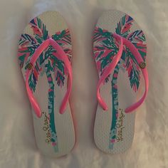 Brand: Lilly Pulitzer Color: Pink And Green Tropical Description: Tropical Printed Sandals Condition: Nwot Size: 7/8 From A Pet And Smoke Free Home! Cute Sandals For Beach Season Vacation, Fun Open Toe Flip Flops For Vacation, Fun Synthetic Flip Flops For Vacation, Fun Flat Flip Flops For Vacation, Fun White Flip Flops For Vacation, White Tropical Open Toe Flip Flops, Cute Pink Flip Flops For Vacation, White Fun Flip Flops For Spring, White Fun Spring Flip Flops