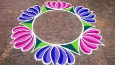 a colorful flower design on the ground