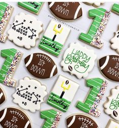 decorated cookies are arranged in the shape of footballs and numbers for birthday party favors