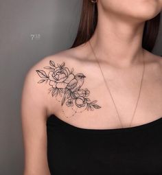 a woman with a flower tattoo on her chest