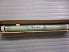 an open box with a tube in it