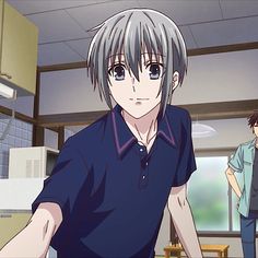 an anime character with grey hair and blue eyes standing in a kitchen next to another person