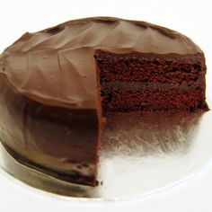 a chocolate cake with one slice missing from it